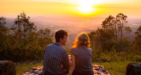 Couple enjoying the sunset from Tamborine Mountain