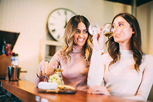 Two women wine tasting at Witches Falls Winery