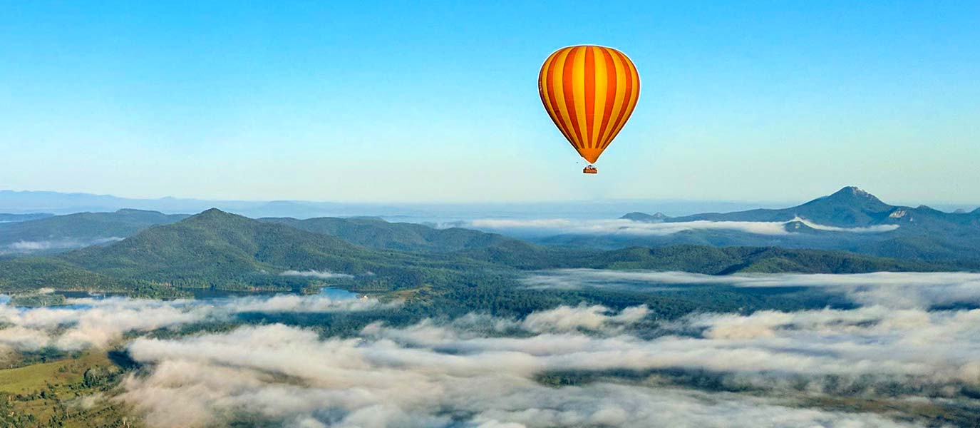 Hot Air Balloon flying above the mist over Scenic Rim